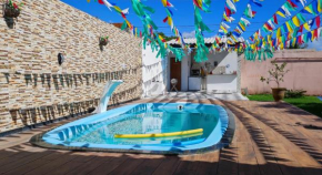 Casa espaçosa gramada com piscina em Barra Jacuípe